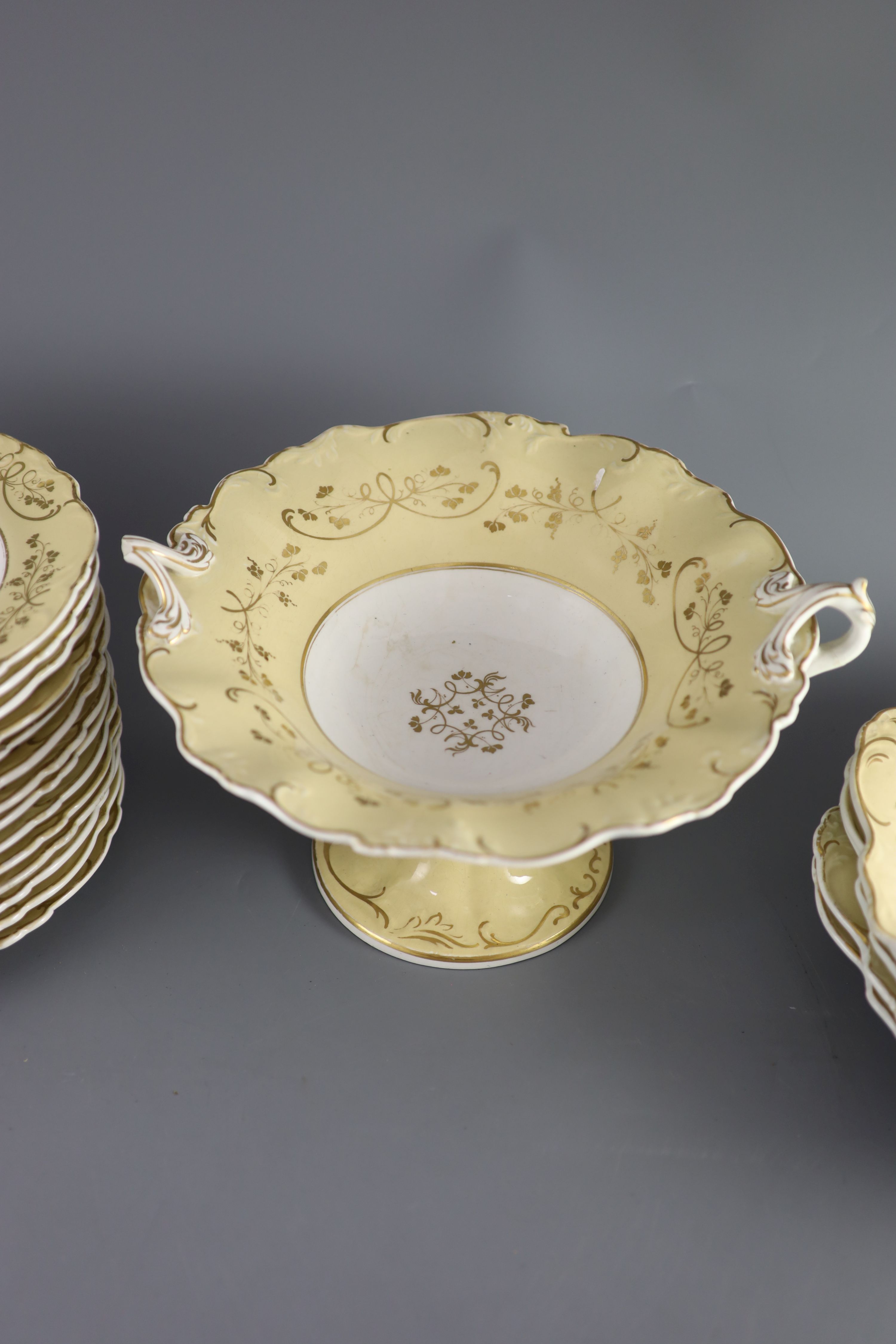 A Staffordshire cream and gilt twenty one piece part dessert service,